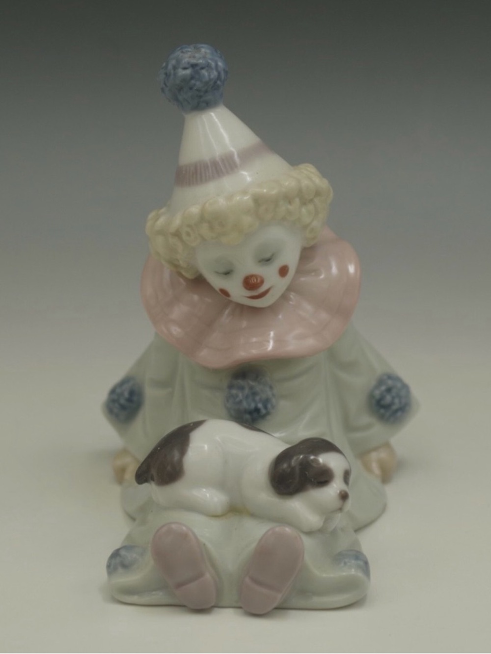 Lladro Pierrot Clown with Puppy Figurine
Made in Spain 
Retired #5277